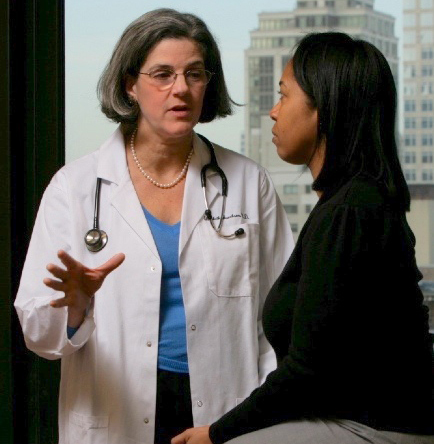 Dr. Elizabeth L. Jacobson with a patient.
